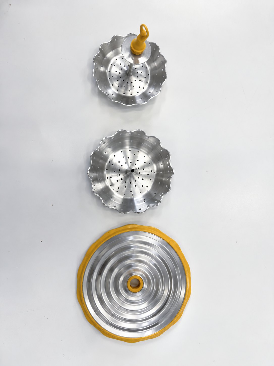 The parts laid out: two trays and the “Skirt” lid