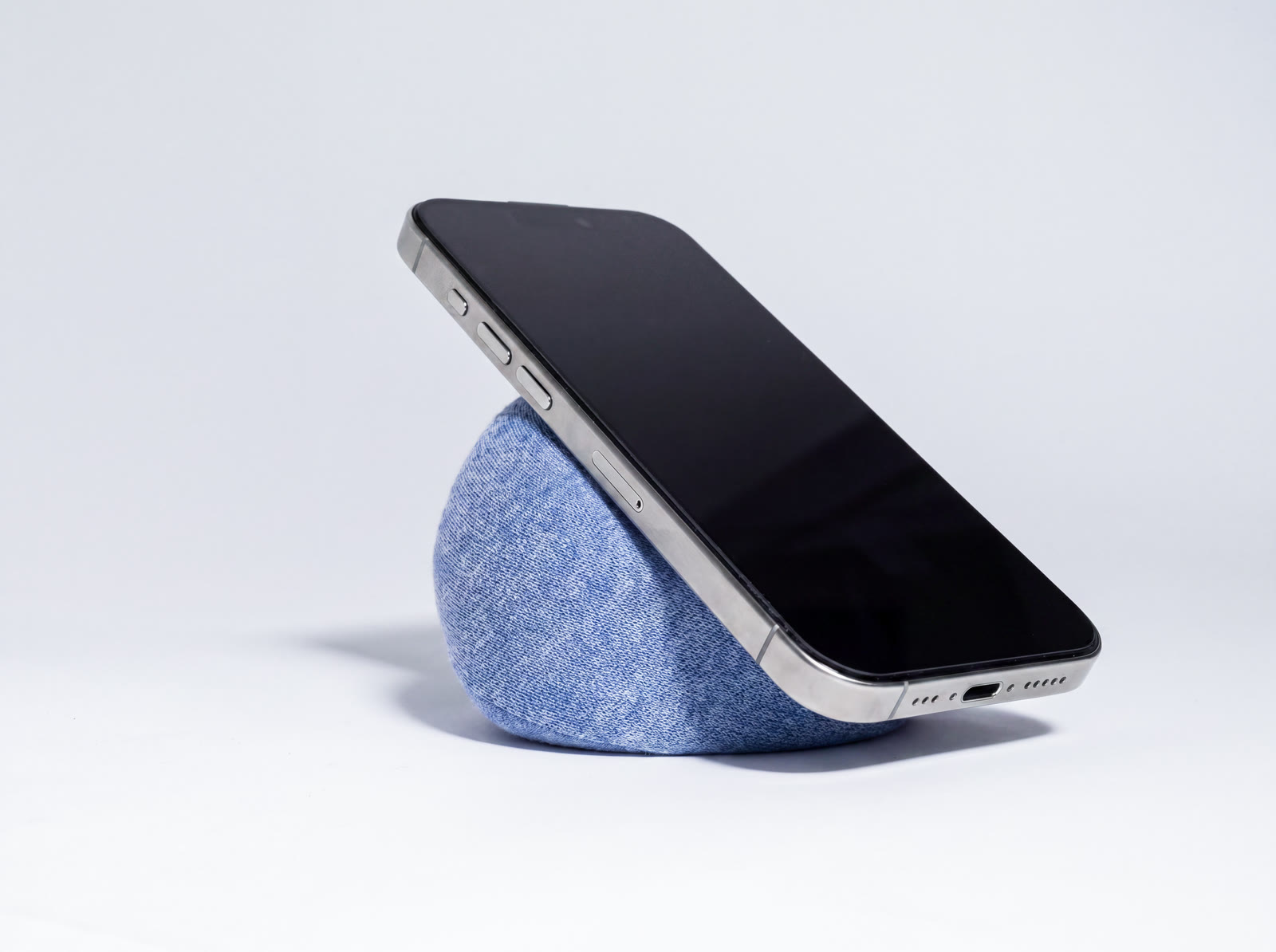 A phone tilted back on NEST