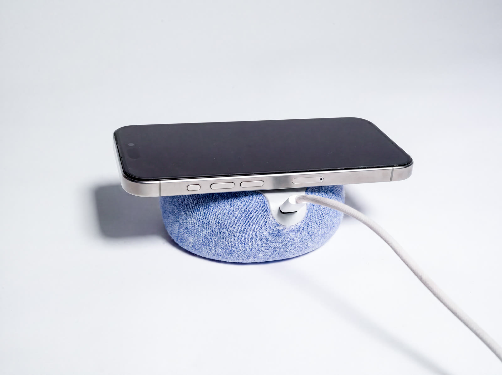 NEST charging a phone through its USB-C cable